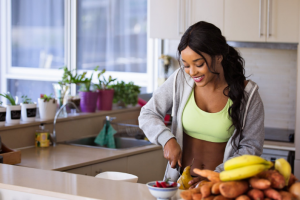 a woman preparing food in the kitchen
