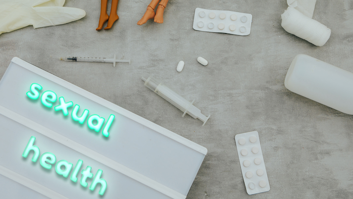 sexual health text and medical items.Top view